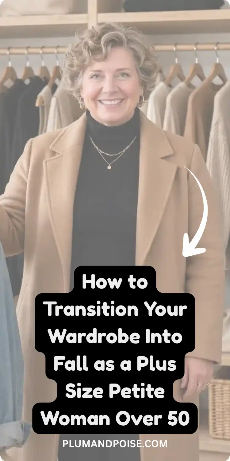 Silver-haired woman over 50 smiling in a camel coat layered over a black turtleneck, standing in front of a closet of neutral fall pieces on wooden hangers. Pin text reads: How to Transition Your Wardrobe Into Fall as a Plus Size Petite Woman Over 50. A practical style guide covering petite plus size proportions, fall outfits, and layering for women over 50.